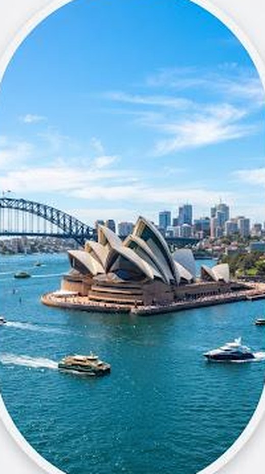 Sydney Opera House and Harbour Bridge seen across the harbour on a clear day